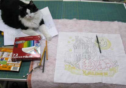 Lucky Kitty assisting with coloring on the Halloween Haunted House from Lindee G Embroidery